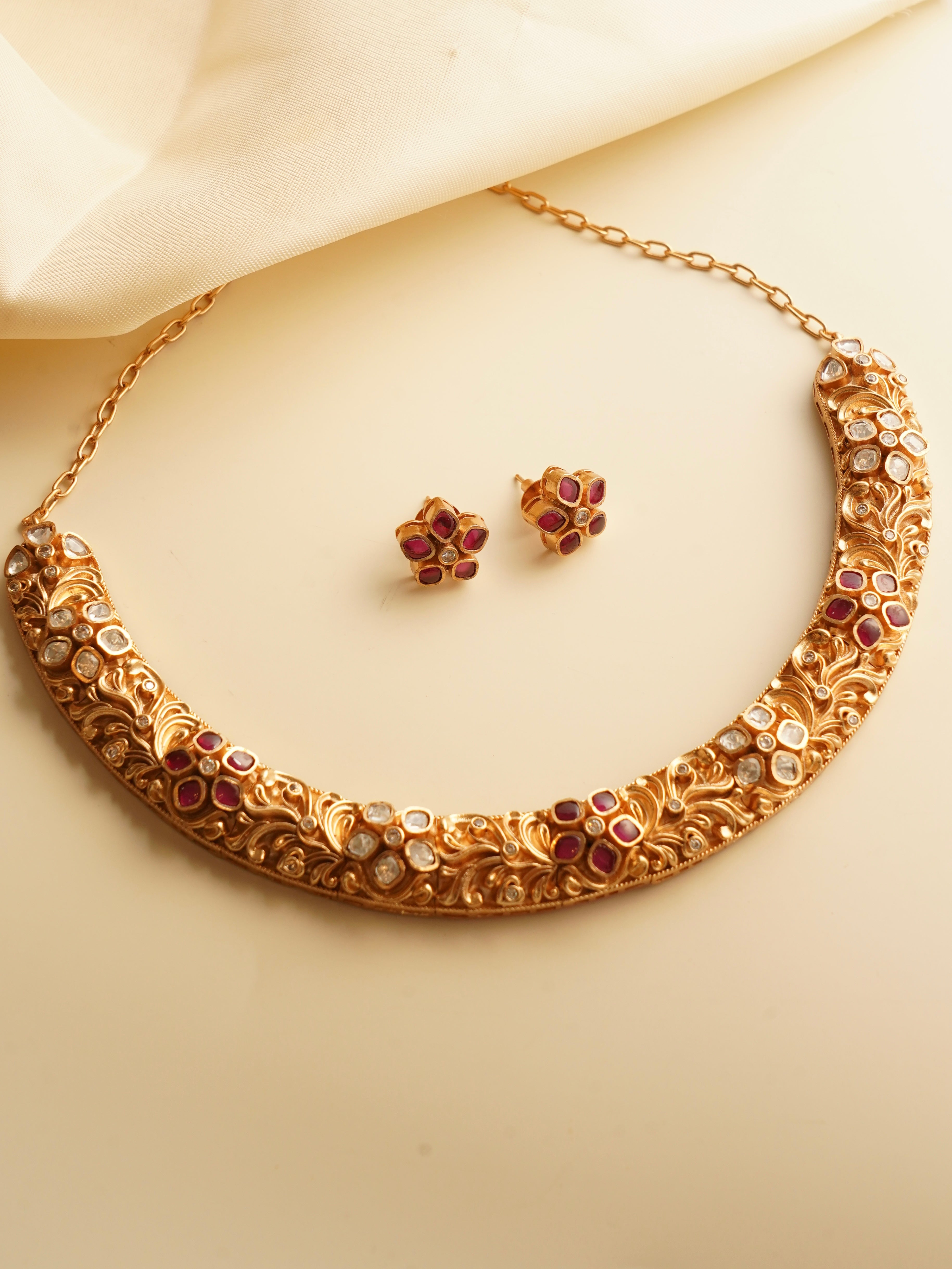 Structured gold-tone polki hasli necklace with floral engravings and uncut polki stones